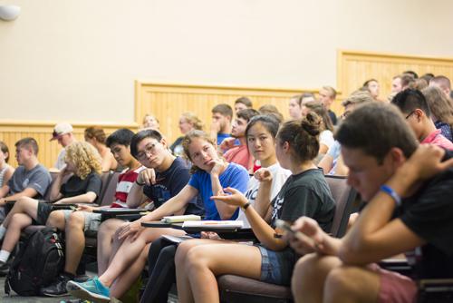 Students sitting in an auditorium.