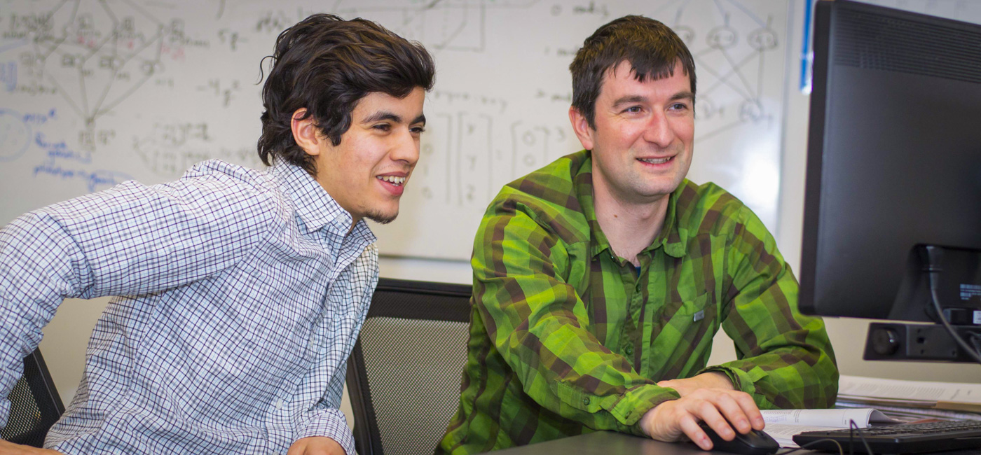 A student working with professor