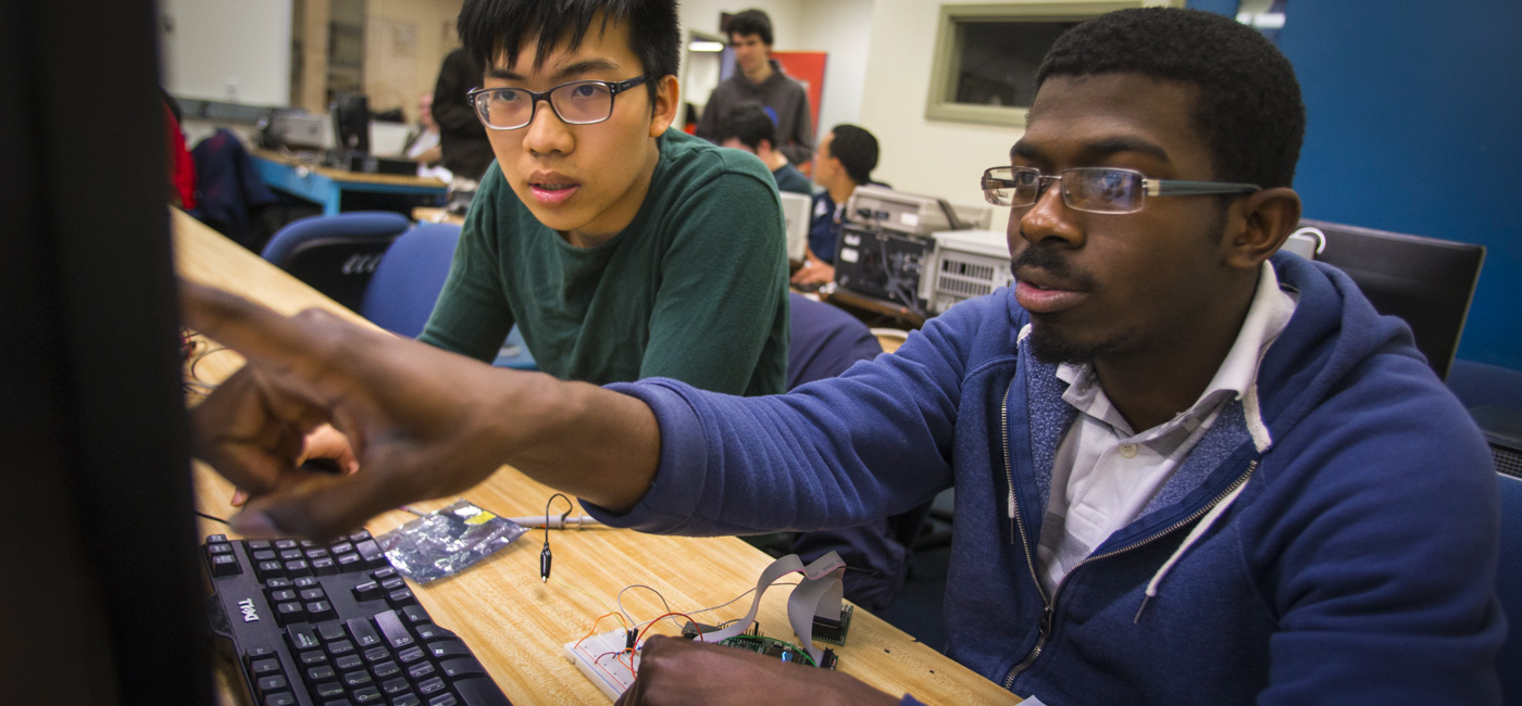 Students working in the lab and working an electrical circuitry
