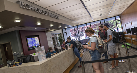 Students in library helpdesk