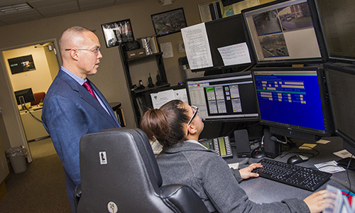 Police looking at computer screens