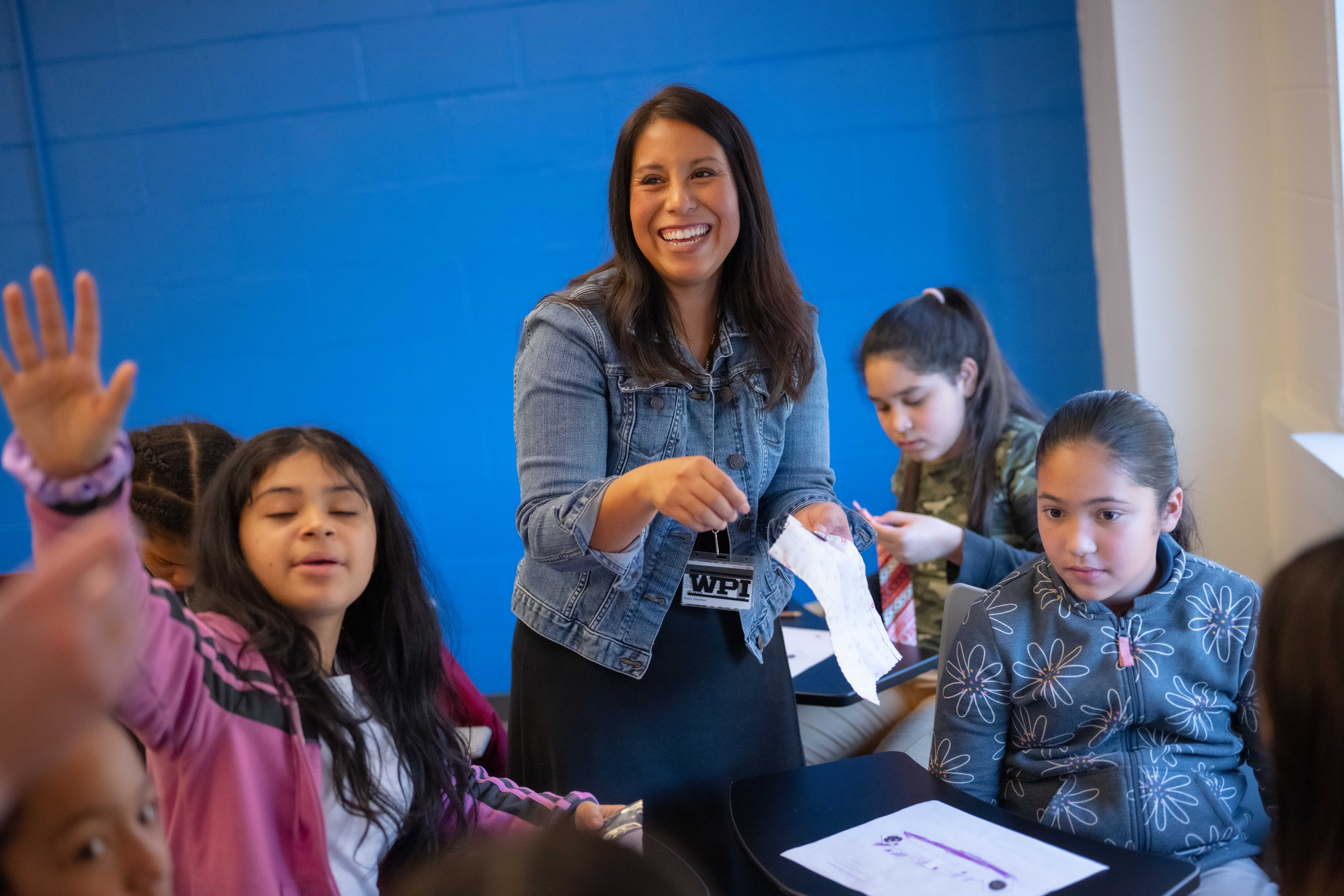 teacher and young students in classroom