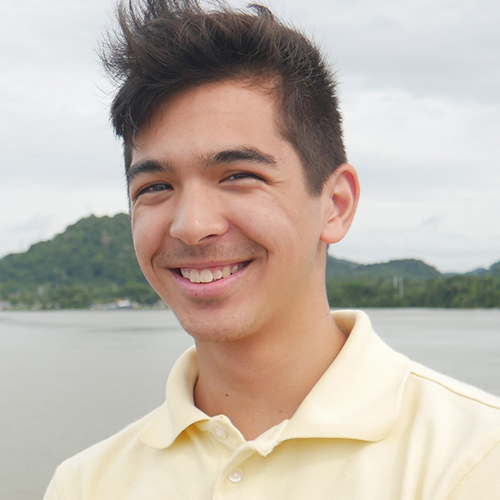 A picture of Zachary Manfredi with a background of a murky lake.