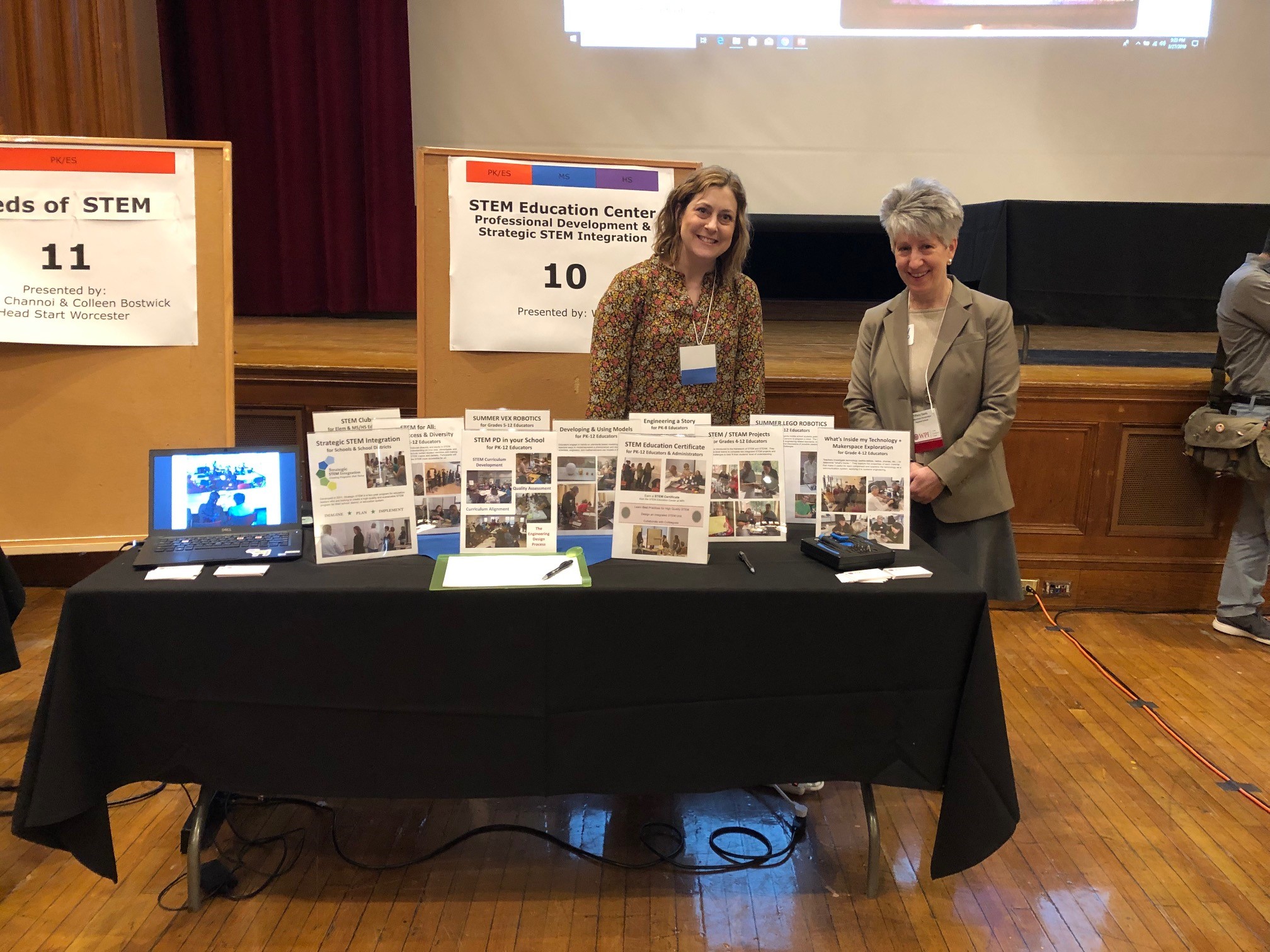 Two teachers at a table with materials
