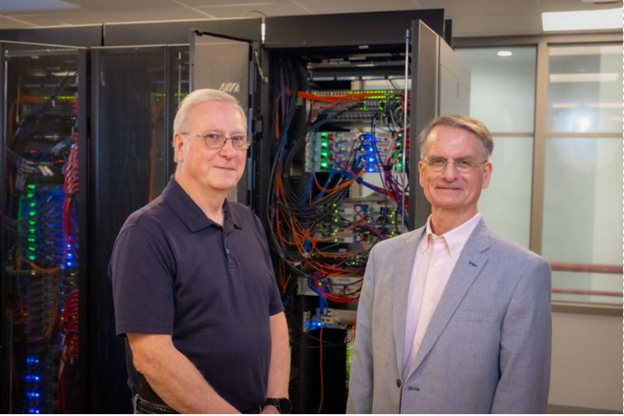 Roger Donahue and David Galvin standing near Banner server.