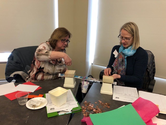 Two teachers designing a bridge