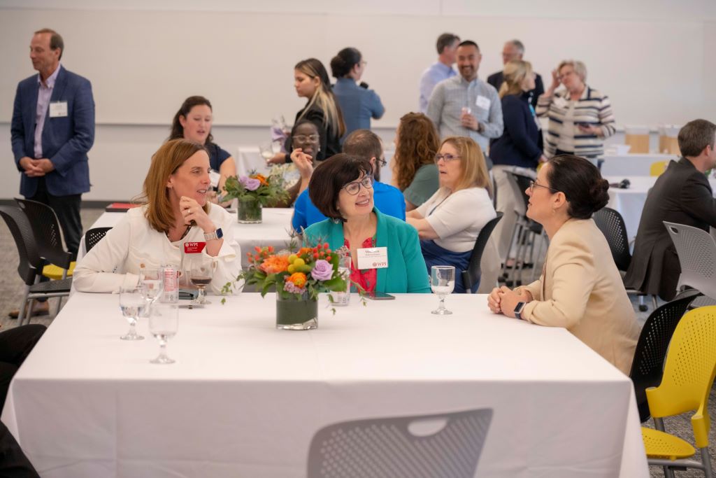 Several women seated at a table at the Board of Trustees Outstanding Staff Awards luncheon