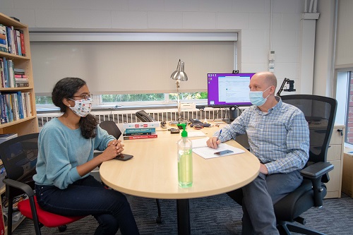 Patrick Schaumont speaks with a student