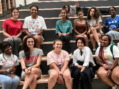 Young prospective women in STEM sitting on steps