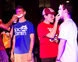 Students getting shaving cream on their faces at Homecoming