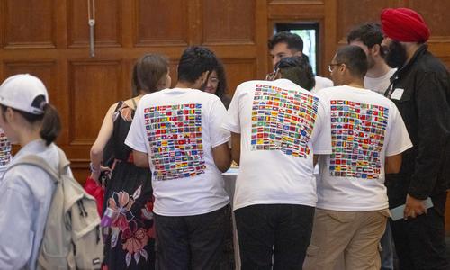 students wearing global flags T-shirt