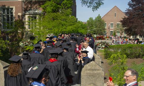 a line of students in commencement gear