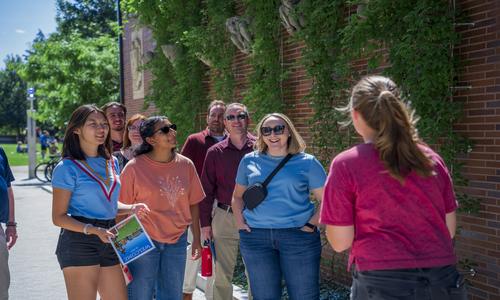 students taking an admissions tour on campus