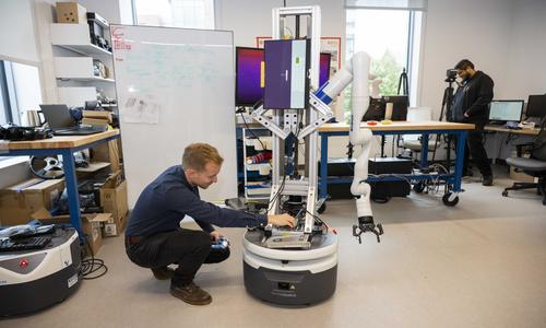 students working in a robotics lab