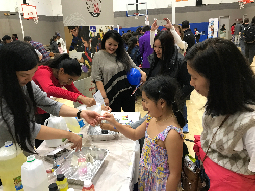 Guests make lava lamps with Mass Academy students