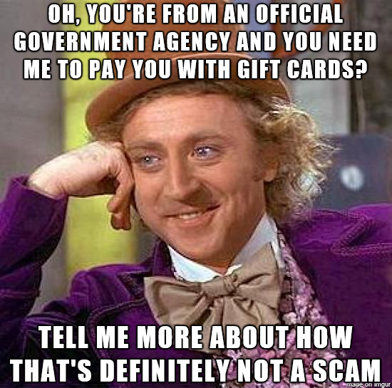 Picture of Gene Wilder dressed as Willy Wonka. He is resting his right elbow on a table and has his face resting on the back of his right hand. The text says, "Oh, you’re from an official government agency and you need me to pay you with gift cards? Tell me more about how that’s definitely not a scam."