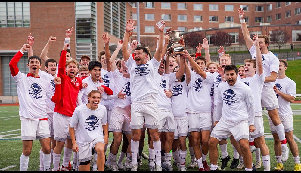 The men’s soccer team celebrates after winning a championship.
