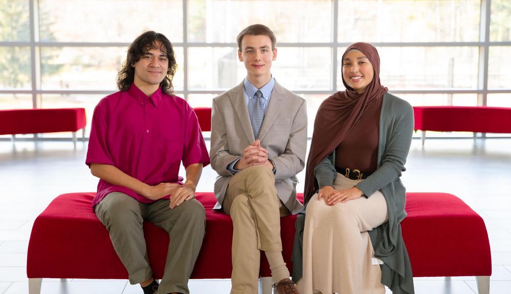 3 people sitting on couch