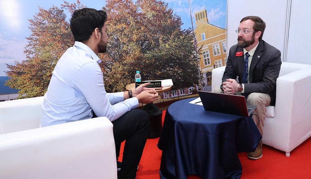 A prospective student meets with a WPI representative in India.