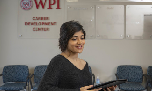Student standing inside the Career Development Center