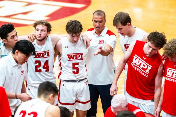 David Brown speaks in team huddle during timeout
