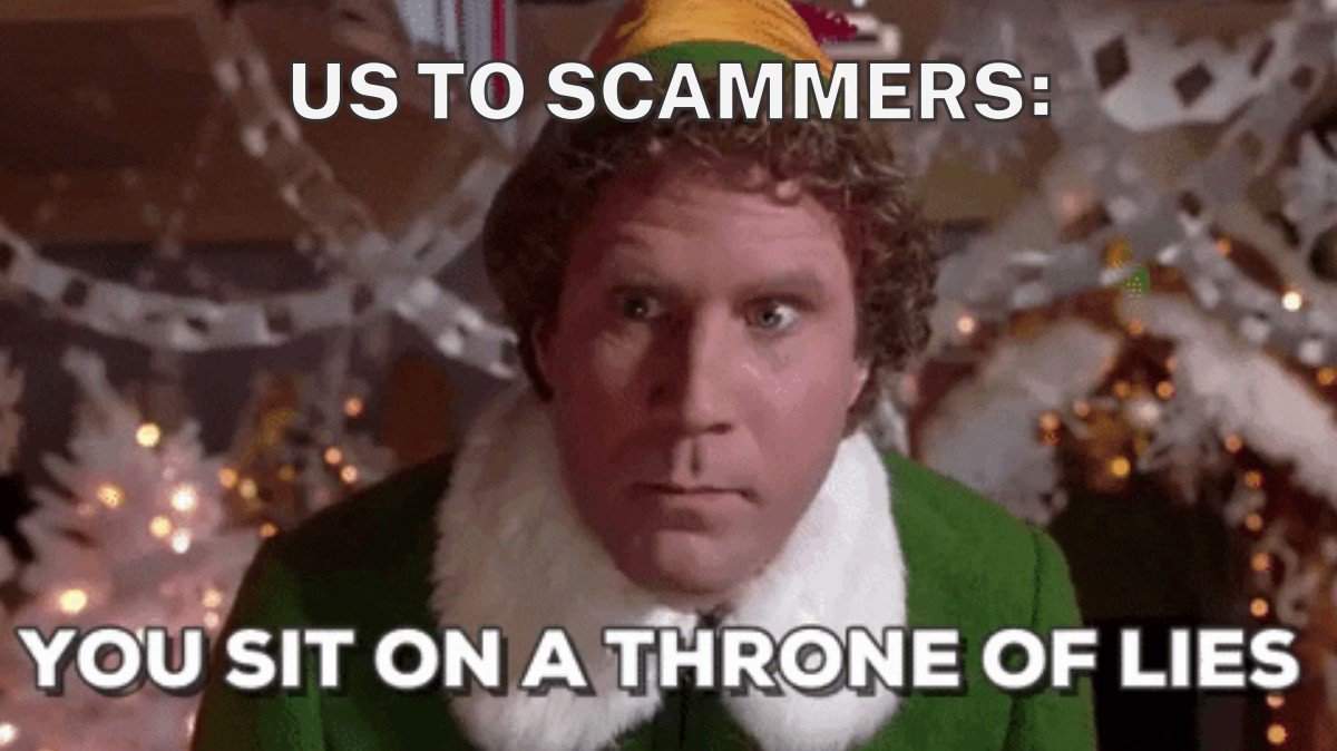 Will Ferrell dressed as Buddy the Elf. The background is slightly out of focus and has a bunch of white Christmas decorations and strings of little white lights. Text says, "Us to scammers: You sit on a throne of lies."