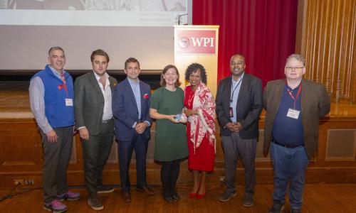 WPI Business School Dean Debora Jackson stands with the organizers of the FFEA conference.