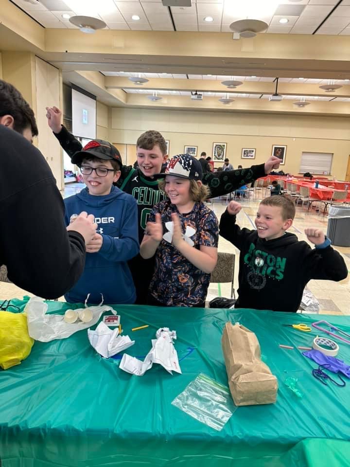 High Powered Rocketry Club member checking to see if the students egg-stronaut survived the ladder drop