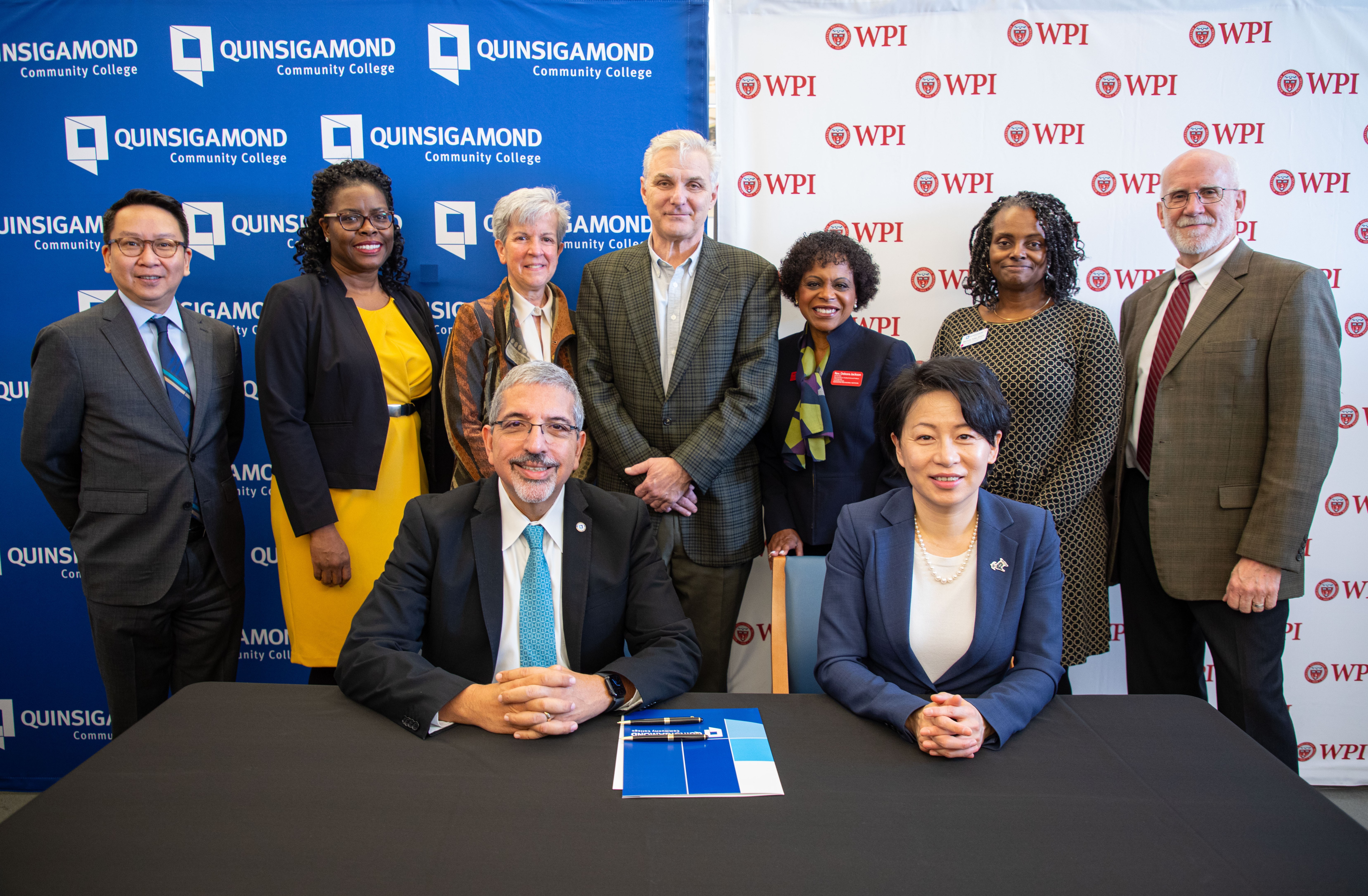 WPI and QCC officials pose for photograph after signing articulation agreement on transfer students