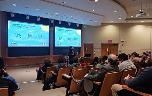 a classroom lecture shown from the back of the room