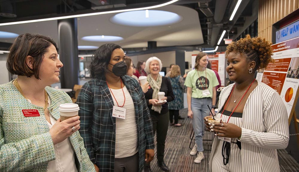 A student shares research during a presentation event in the Innovation Studio.