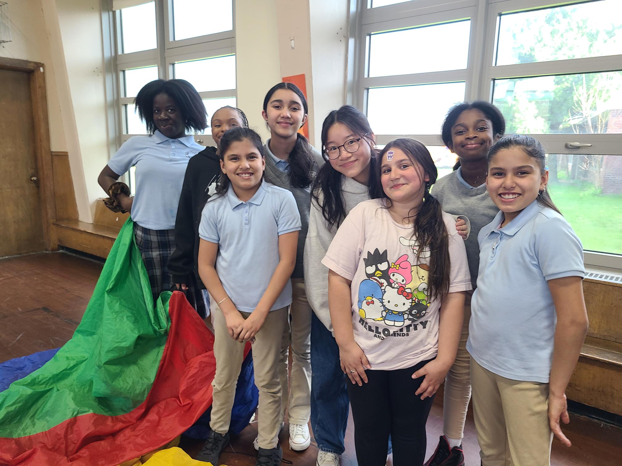 WPI Student Grace Ho (back center) and elementary students participating in afterschool moving activities.