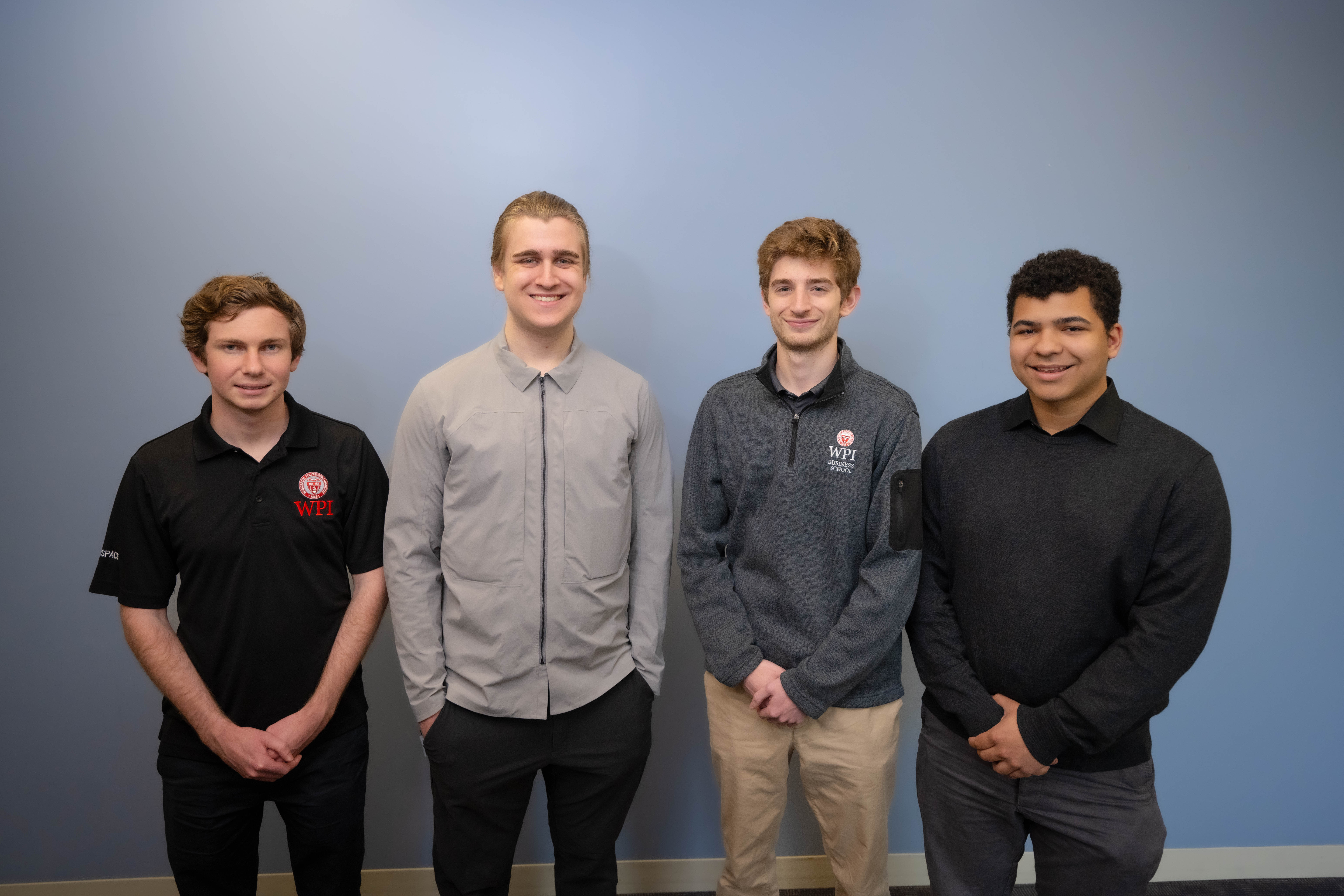 4 WPI seniors who were members of project team that won a Best Paper Award, pose for photograph together