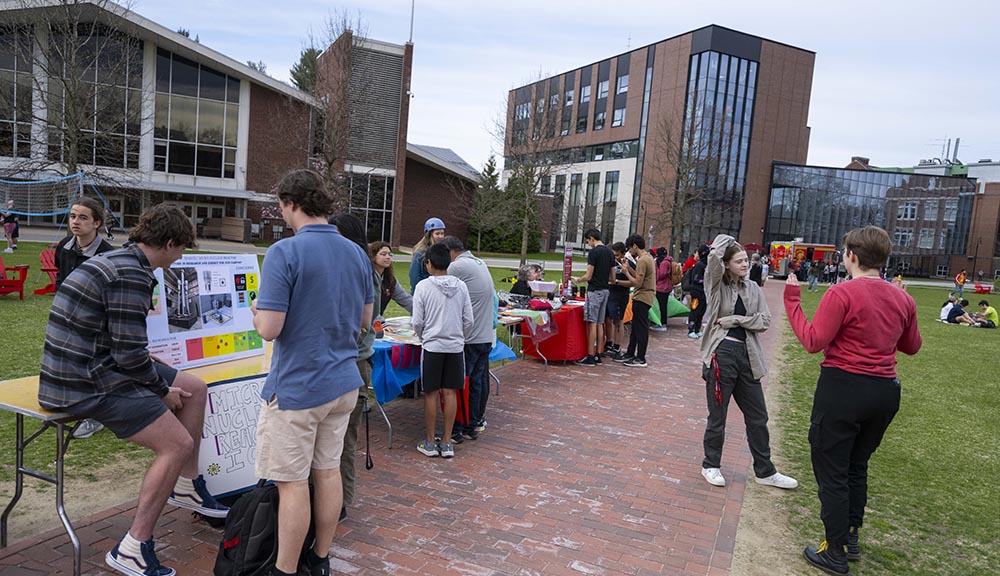 Students attend the Climate Action Fair on the quad.