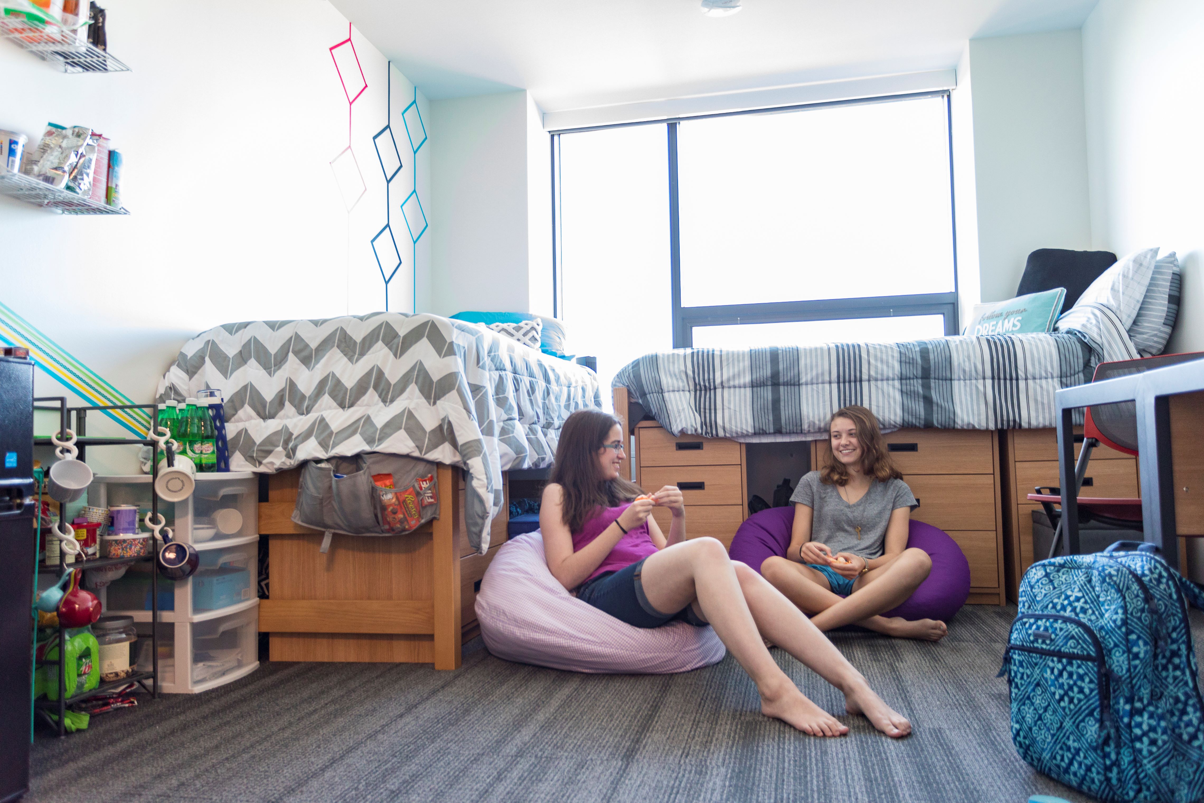students sitting in dorm