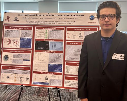 student presenting research on a poster