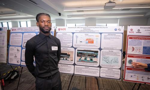 student presenting research on a poster