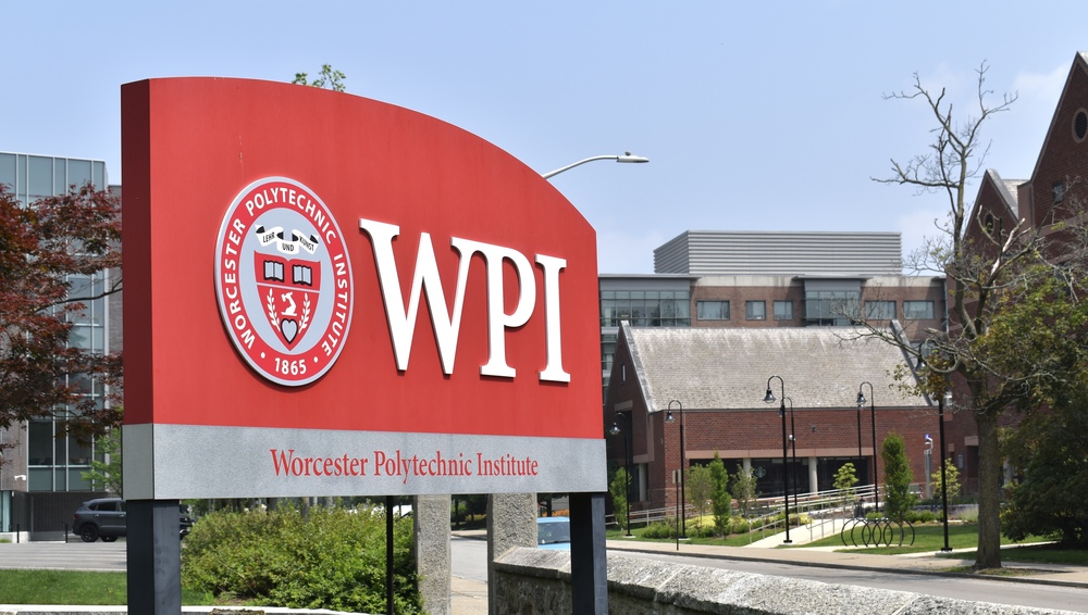 A WPI sign is displayed on the Worcester Polytechnic Institute campus, where five teaching professors have been appointed to an innovative tenure track for faculty who focus on teaching.