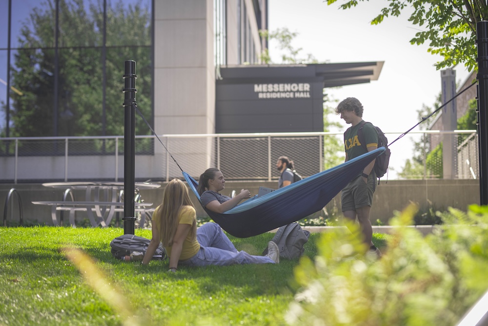 The group’s class gift of a hammock space behind the Rubin Campus Center offers hammocks and a picnic table to connect with others or catch up on some R&amp;R.