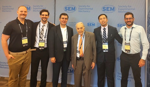 Cosme Furlong poses with WPI students and SEM Fellow Cesar Sciammarella at 2024 SEM conference. From left, PhD students Anthony Salerni and Daniel Ruiz-Cadalso; Furlong; Sciammarella; and PhD students Howard Zheng and Jonathan Oliveira-Luiz.