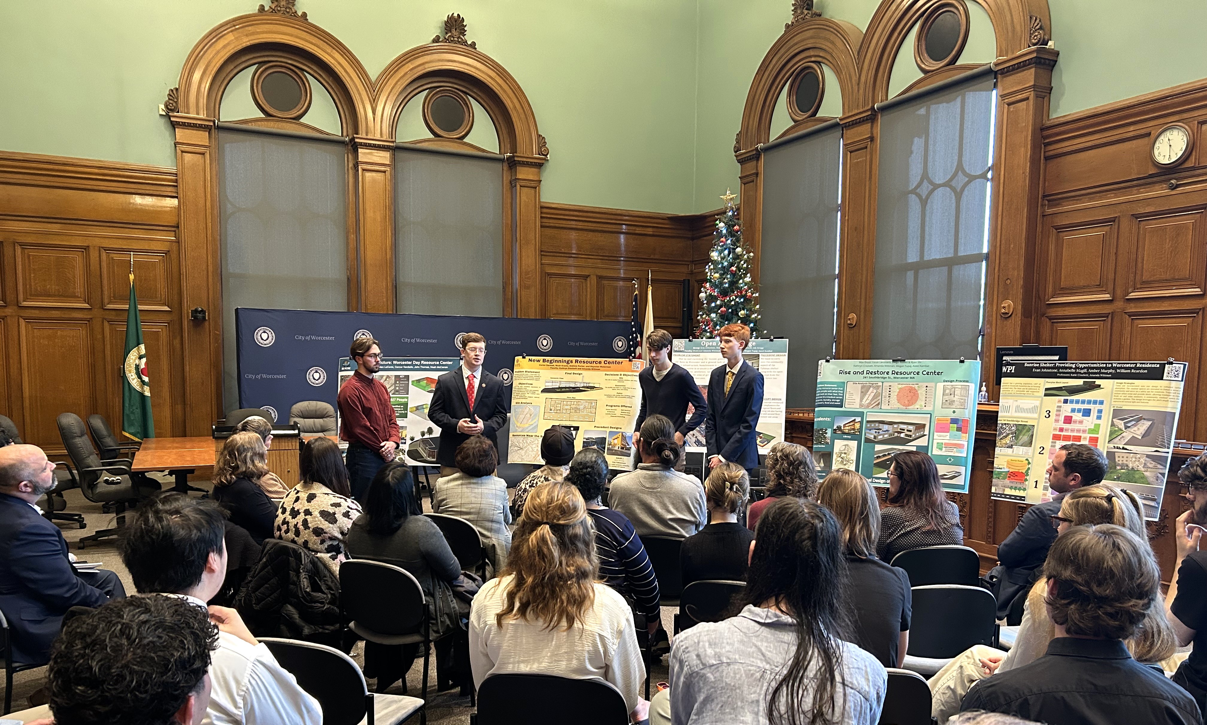 student presenting research at Worcester City Hall