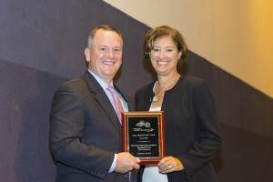 President Leshin accepts a Chamber of Commerce “salute” for WPI’s 150th from chamber head Tim Murray.