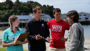 Students Jessica Desmond, Matthew Dunster and Thomas Nuthmann with Jennifer Ross, who works for the New Zealand Department of Conservation.