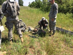 Cadets prepare to evacuate a mock patient from the battlefield.