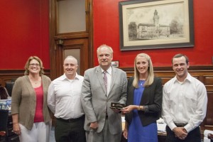 Mayor Joe Petty and Liz Pellegrini ’16, center, with from left, Dana Harmon, Brian Chabot and Miles Ketchum.