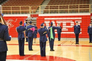 Cadet guidons stand in formation.