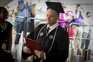 ​Michael Vaudreuil, diploma in hand, during the May 14 Commencement.