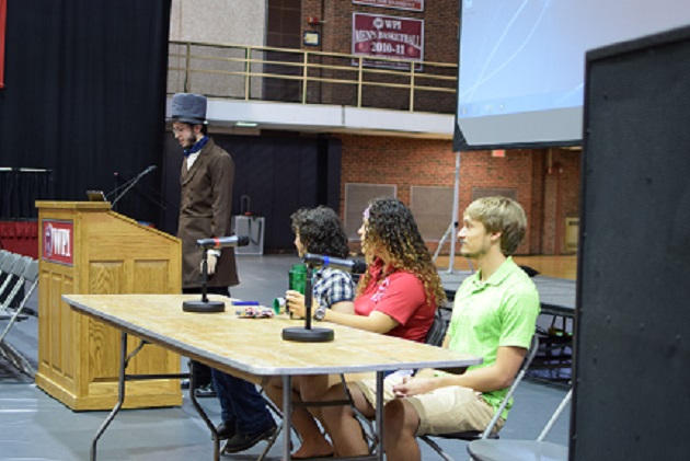 Student John Bosworth at the podium, dressed as John Boynton, with student panelists Katie Picchione, Norma Bachman, and Kevin Ackerman.