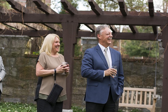 Eric Overström and his wife, Lori, enjoy a light moment during the program.