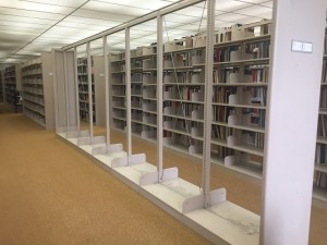 This stack of books is being relocated to make room for an expanded restroom.